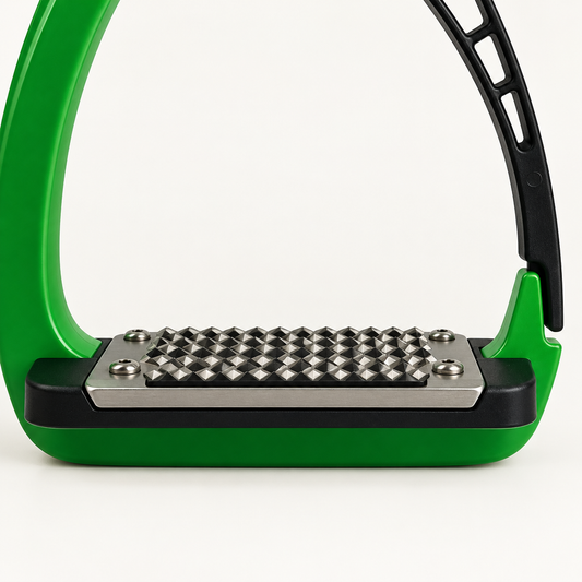 Close-up of the silver studded tread plate, black base insert and green lower frame of an Acavallo Arena Alupro stirrup