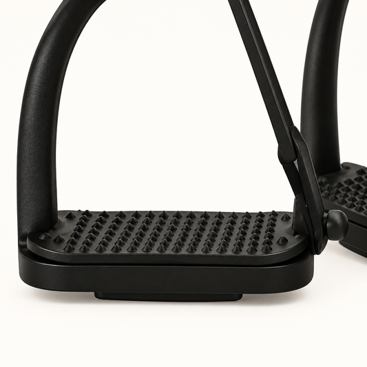 Close-up of the black BI-028 stirrup's textured tread, lower frame and outer arm connection
